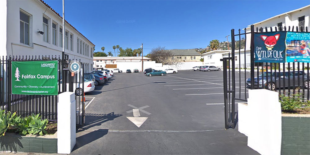 Man Aims Rifle at Charter School