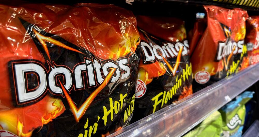Kenwood High School's AI security system mistakenly flagged a student's Doritos bag as a firearm. Miscommunication among administrators following the alert led to a student being handcuffed. weapons detection, gun detection, Omnilert
