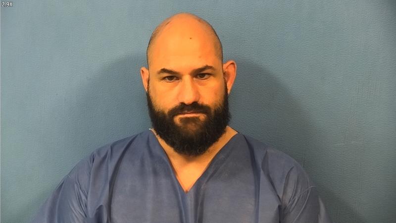 A Fenton High School security officer who was previously a police officer faces charges of home invasion, animal cruelty, drug possession, and more. Carmen Mirandola, Fenton High School District 100