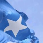 The temporary flying of the Somali flag by the Winooski School District was a gesture of solidarity with the district’s Somali community, which comprises about 9% of its student population. Vermont Somali Flag Incident, online harassment and threats, social media amplification, Libs of TikTok, right-wing podcaster Benny Johnson, ICE