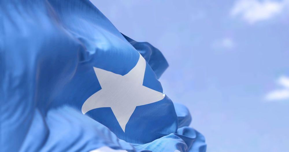 The temporary flying of the Somali flag by the Winooski School District was a gesture of solidarity with the district’s Somali community, which comprises about 9% of its student population. Vermont Somali Flag Incident, online harassment and threats, social media amplification, Libs of TikTok, right-wing podcaster Benny Johnson, ICE